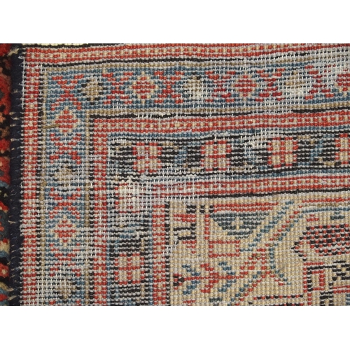 887 - A red ground Araak rug