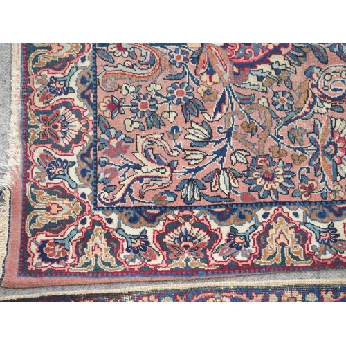 890 - A Kirman rug