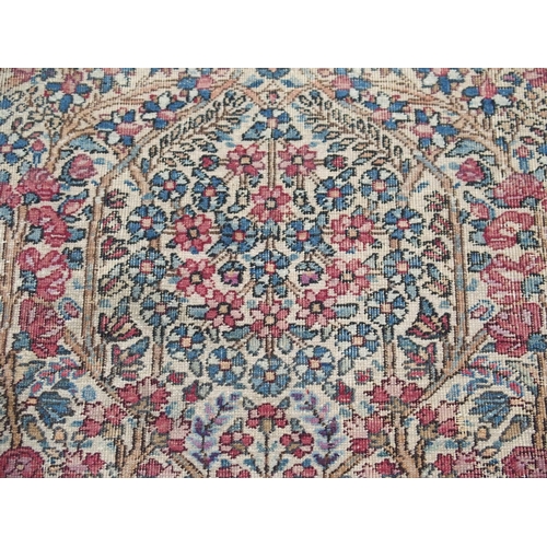 890 - A Kirman rug