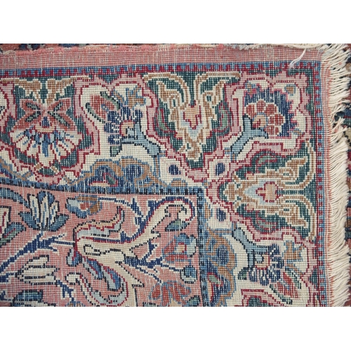 890 - A Kirman rug