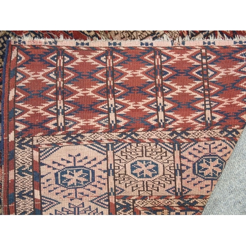 891 - A red ground Bokhara rug