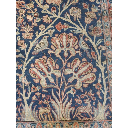 892 - A blue ground tree of life rug