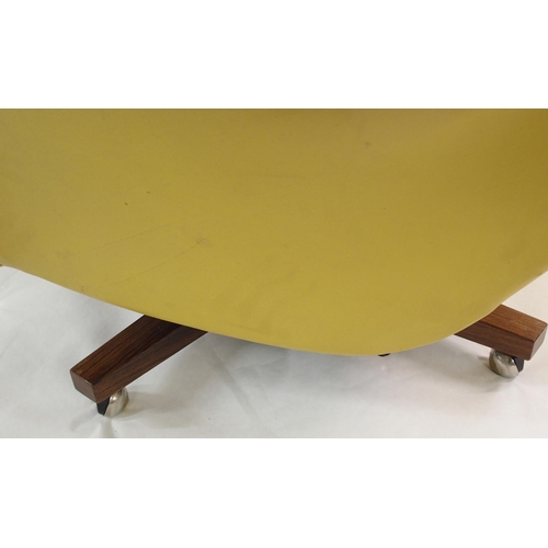 900 - A 1960's yellow leather button back swivel rocker