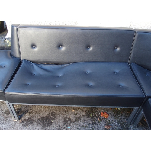 903 - A 1970's black vinyl and chrome five-sectional corner suite