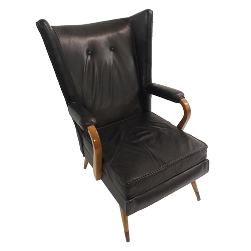 910 - A Furpro Furniture 1960's black leather wingback chair