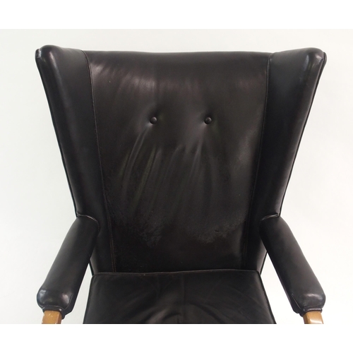 910 - A Furpro Furniture 1960's black leather wingback chair