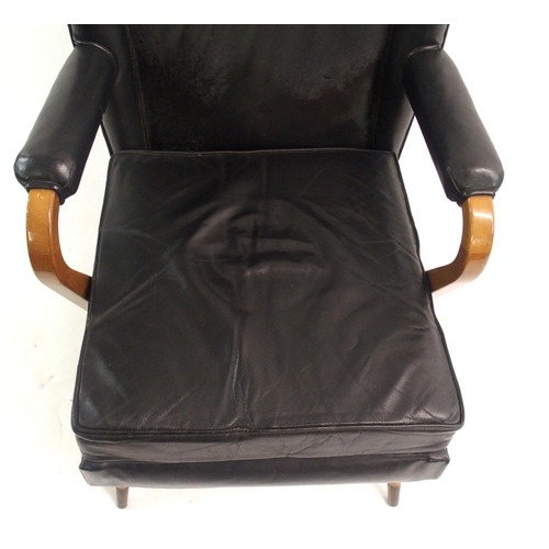 910 - A Furpro Furniture 1960's black leather wingback chair