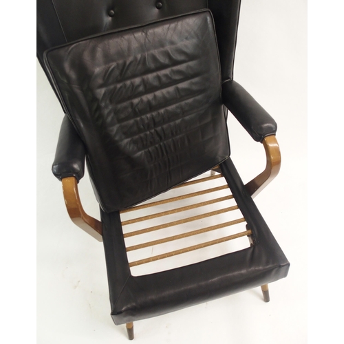 910 - A Furpro Furniture 1960's black leather wingback chair