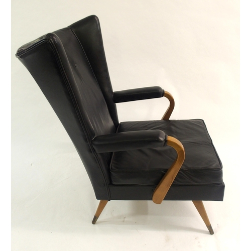 910 - A Furpro Furniture 1960's black leather wingback chair