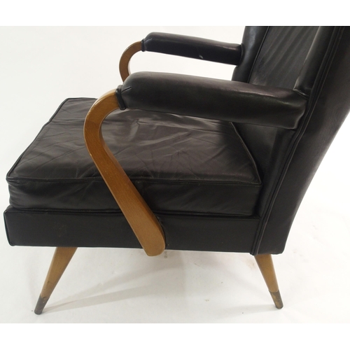 910 - A Furpro Furniture 1960's black leather wingback chair