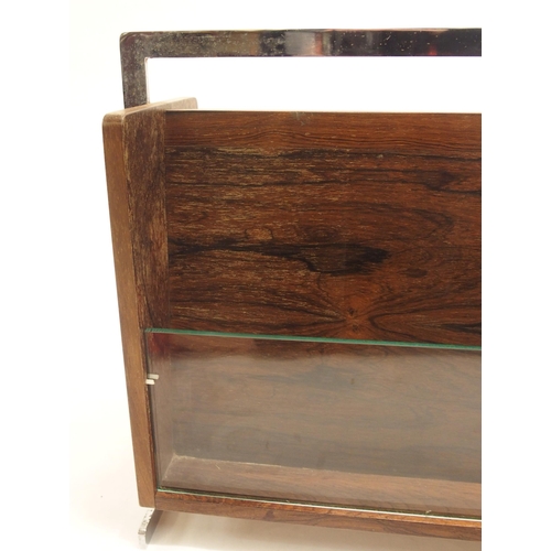 914 - A Richard Young  Merrow Associated rosewood veneered and chrome magazine rack