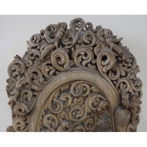 139 - A large Burmese carved hardwood panel