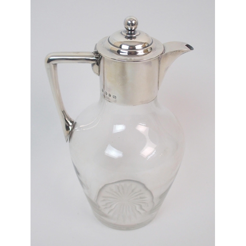 161 - A late Victorian silver-topped claret jug