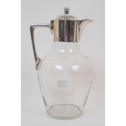 161 - A late Victorian silver-topped claret jug