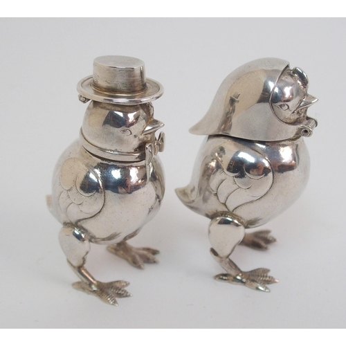 167 - A pair of novelty white-metal pepperettes formed as chicks