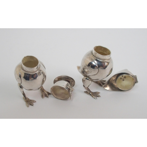 167 - A pair of novelty white-metal pepperettes formed as chicks