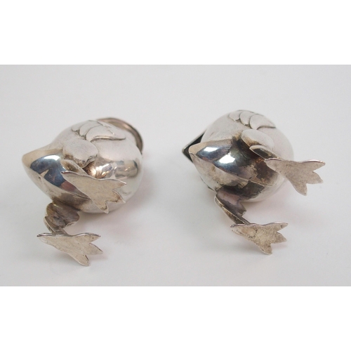 167 - A pair of novelty white-metal pepperettes formed as chicks