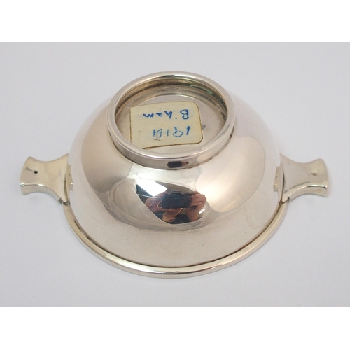 169 - A silver quaich with pierced handles