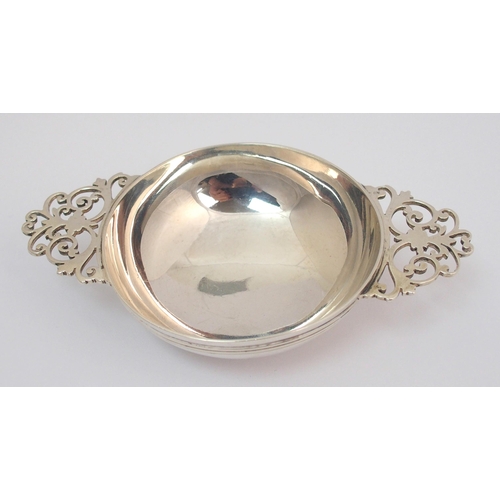 169 - A silver quaich with pierced handles