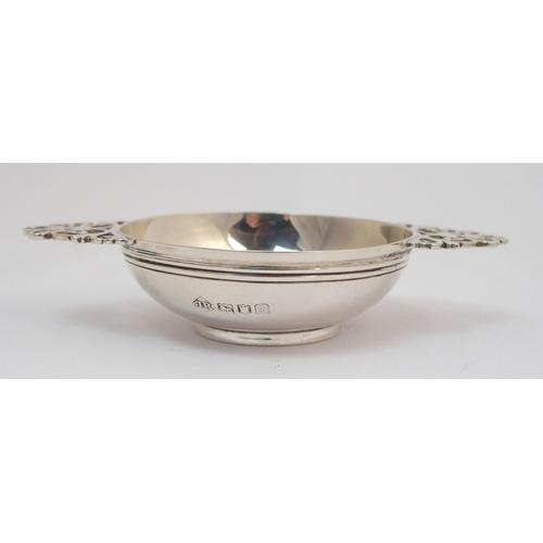 169 - A silver quaich with pierced handles