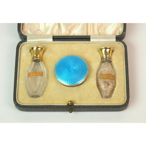 176 - A cased silver and enamel pair of scent bottles with matching pill box