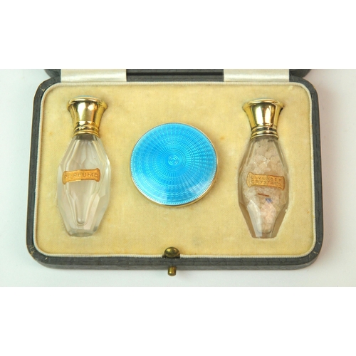 176 - A cased silver and enamel pair of scent bottles with matching pill box