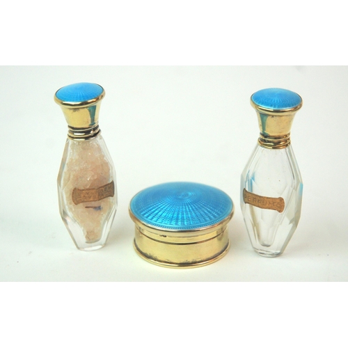 176 - A cased silver and enamel pair of scent bottles with matching pill box