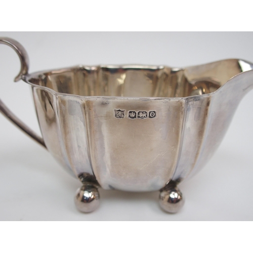 181 - A silver three piece tea set