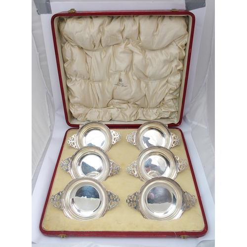 184 - A cased set of six silver porringers with pierced handles