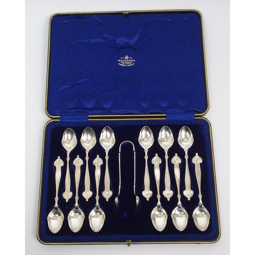 195 - A set of twelve Art Nouveau silver coffee spoons and tongs