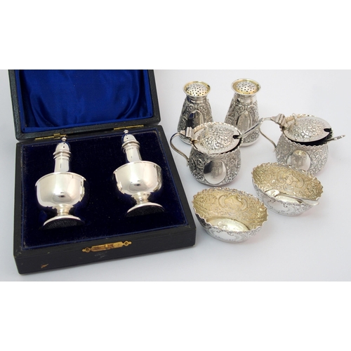 203 - A cased pair of silver pepperettes