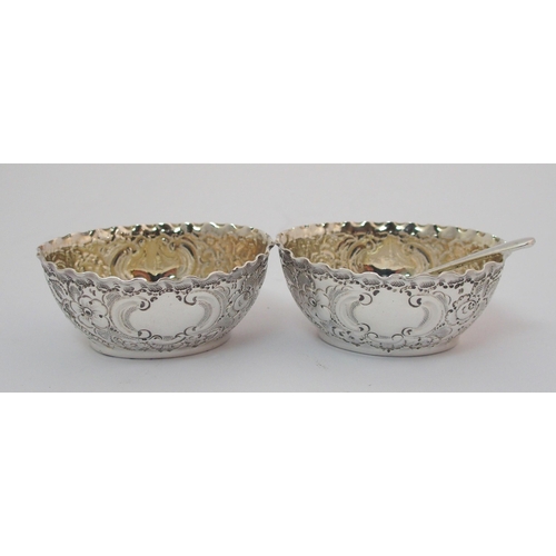 203 - A cased pair of silver pepperettes