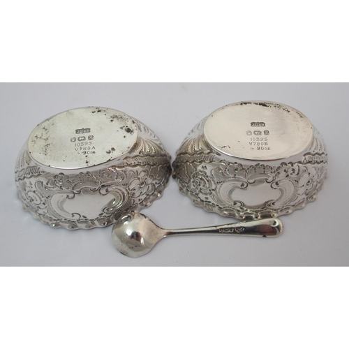 203 - A cased pair of silver pepperettes