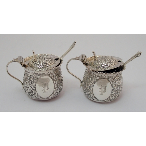 203 - A cased pair of silver pepperettes