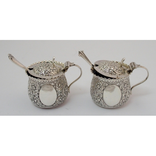 203 - A cased pair of silver pepperettes