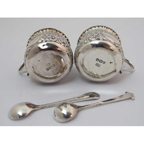 203 - A cased pair of silver pepperettes