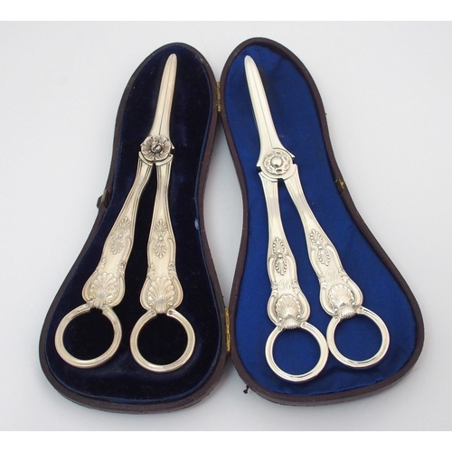 205 - A pair of cased silver grape scissors