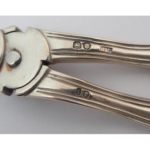 205 - A pair of cased silver grape scissors