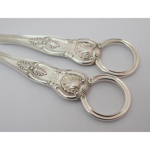 205 - A pair of cased silver grape scissors