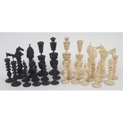 257 - An early carved chess set