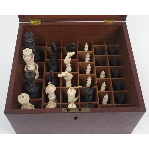 257 - An early carved chess set