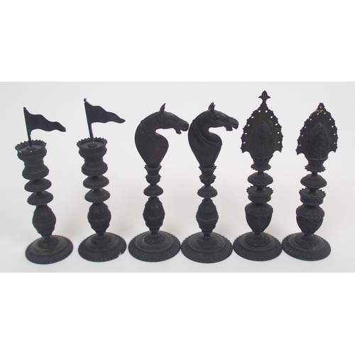 257 - An early carved chess set