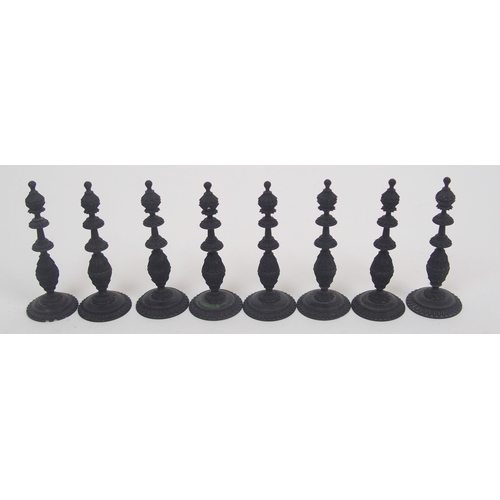 257 - An early carved chess set