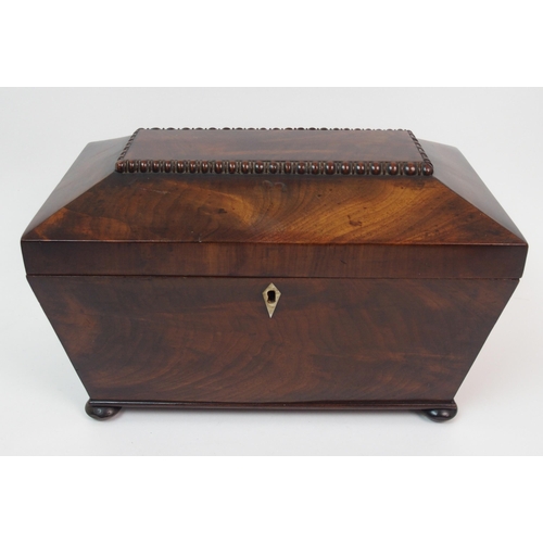 266 - A Victorian mahogany sarcophagus-shaped two division tea caddy