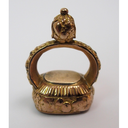 269 - An early 18th century gilt-metal fob seal depicting the bust of John Wesley