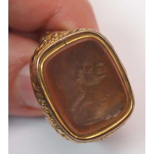 269 - An early 18th century gilt-metal fob seal depicting the bust of John Wesley