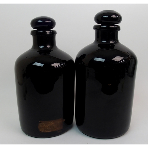 271 - Two early 19th century large purple glass pharmacy bottles