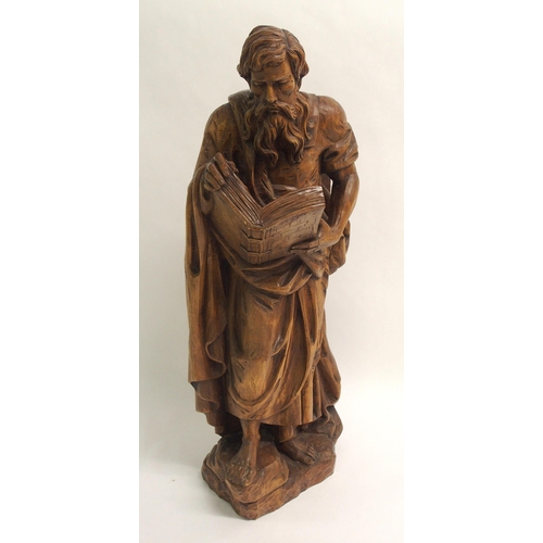 274 - An early 20th century carved wood figure of a biblical scholar