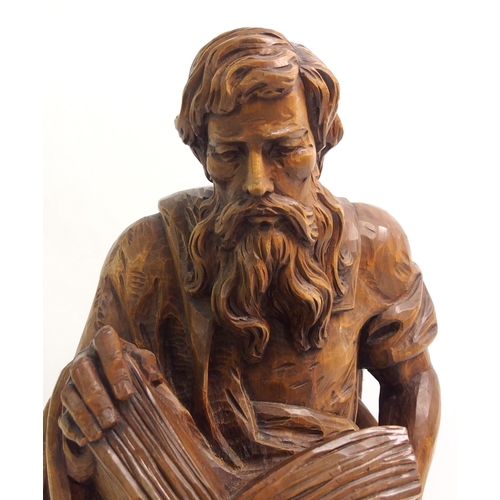 274 - An early 20th century carved wood figure of a biblical scholar