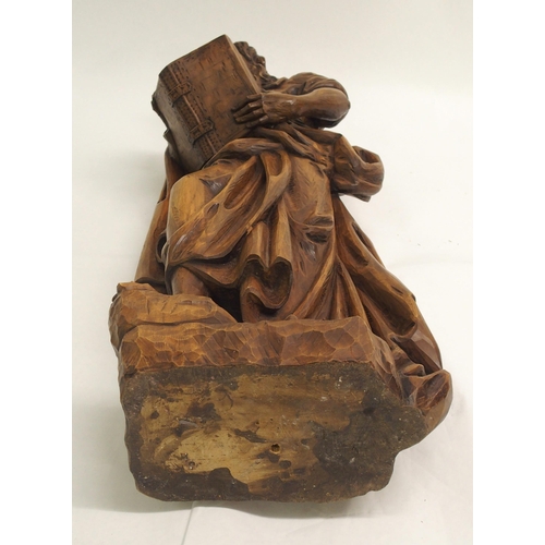 274 - An early 20th century carved wood figure of a biblical scholar